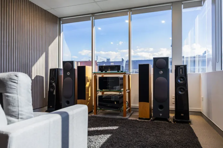 The Audio Revival listening area with a chair facing a complete hi-fi system