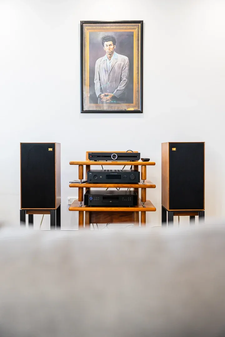 A portrait view of a vintage amplifier and speaker system in the Audio Revival showroom