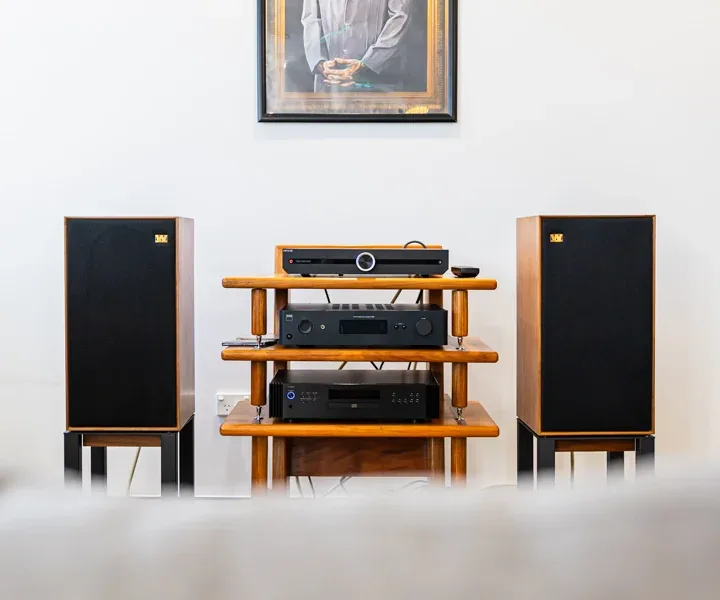 A portrait view of a vintage amplifier and speaker system in the Audio Revival showroom