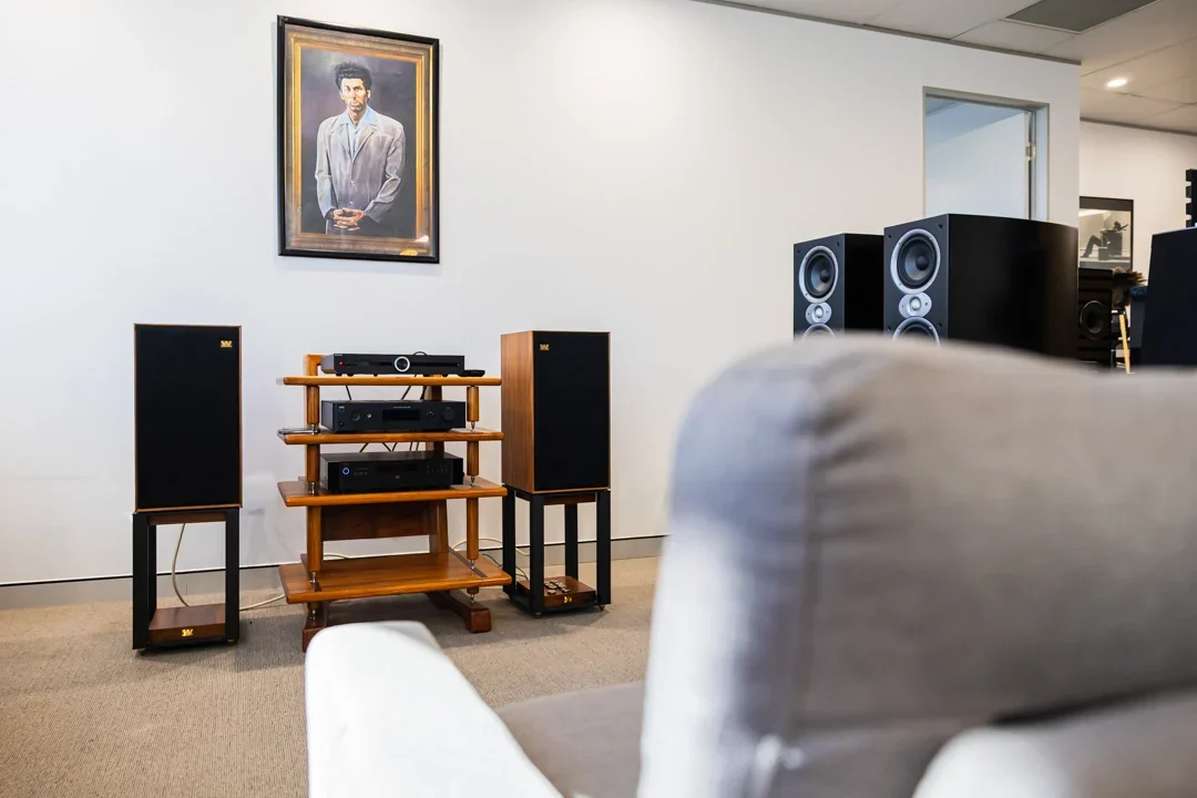 A vintage hi-fi system with standmount speakers set up inside Audio Revival